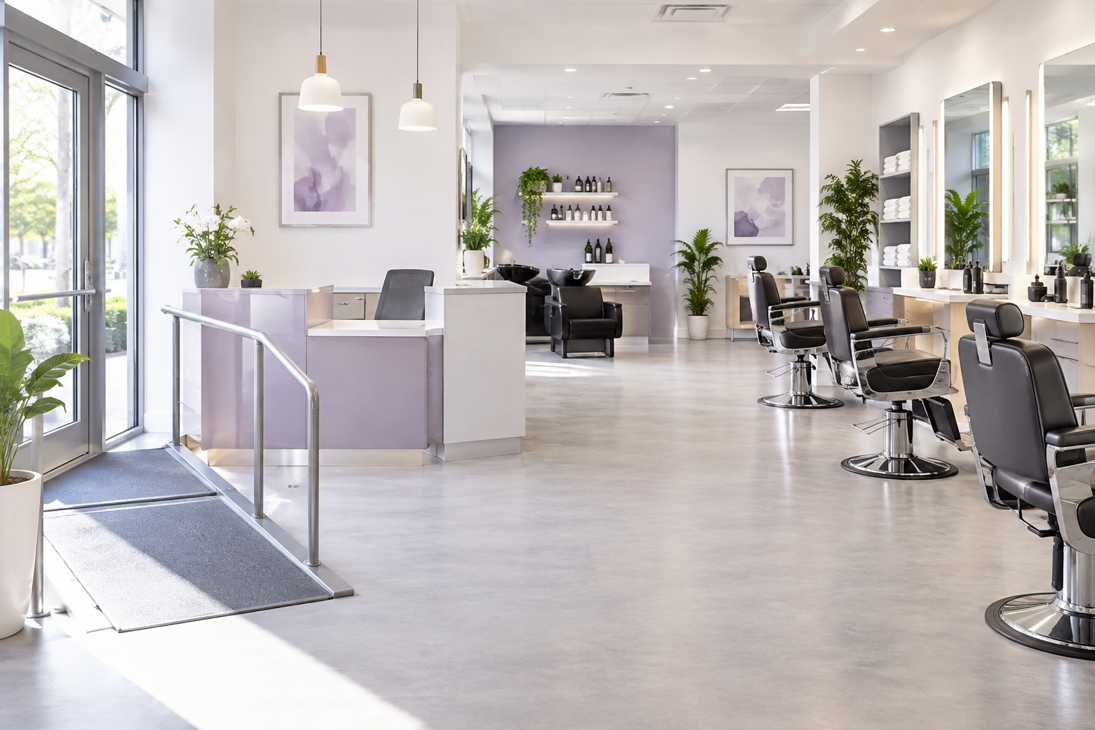 A modern barbershop with wide aisles between chairs, featuring a ramp at the entrance and a receptio